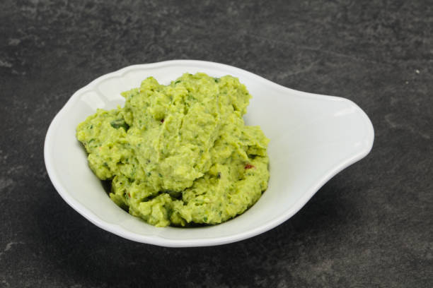 istock Avocado guacamole sauce with chili pepper 1290650275