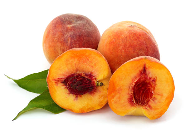 istock Sliced peach and leaves. 1290652737
