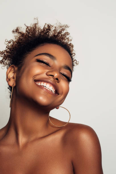 istock Beautiful afro woman with earrings 1290653037