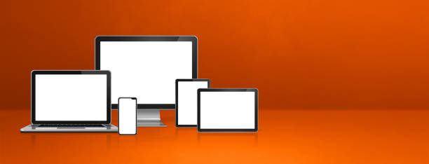 istock computer, laptop, mobile phone and digital tablet pc. orange banner 1290654524