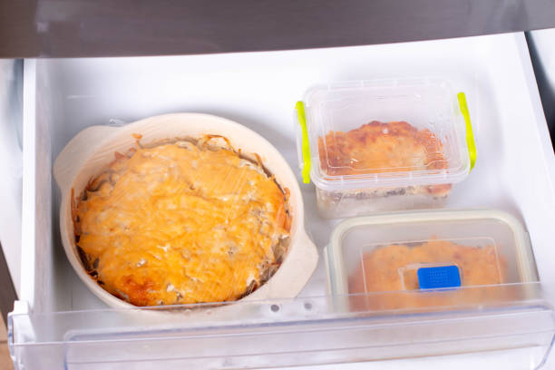 istock Cheese casserole in a baking dish and in containers in the freezer 1290654573