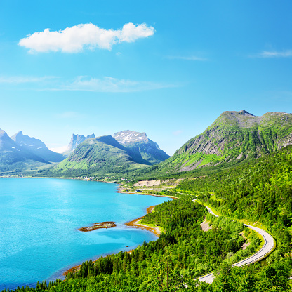 Bergsfjorden summer view on the island of Senja, in Troms county, Norway. Composite photo