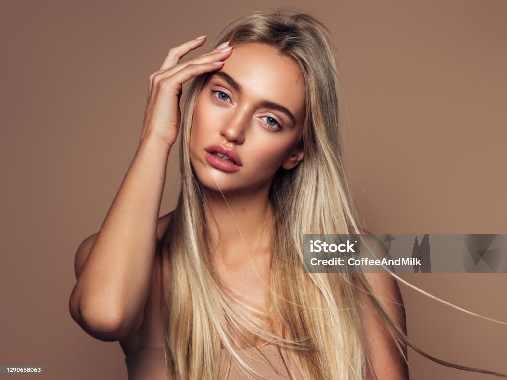 Portrait of a beautiful woman with natural make-up Women Stock Photo