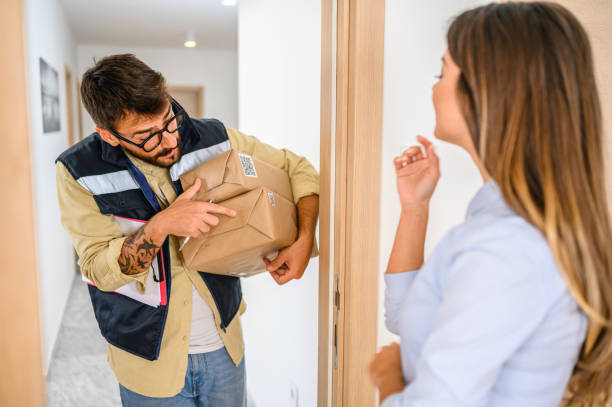 istock Woman received the parcel from the delivery man 1290659332