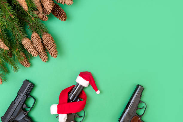 istock Three pistols on a green background. Christmas concept 1290660964