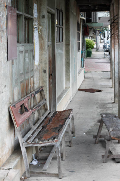 istock Old bench at shophouse in Trang city, Thailand 1290661069