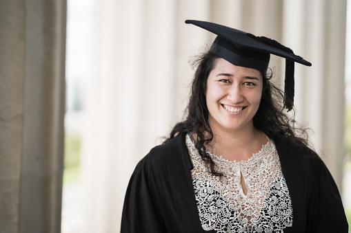 Young Maori woman freshly graduated from university in Auckland, New Zealand.