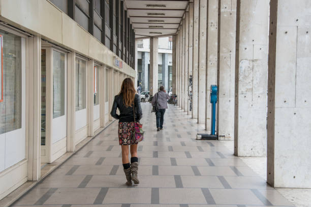 young woman walking alone in a city