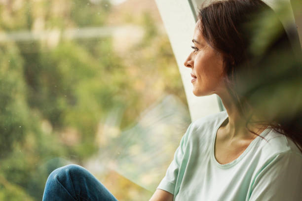 istock Contemplating while looking out of the window 1290664031