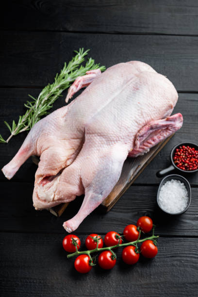 istock Raw duck meat on black wooden table 1290665245