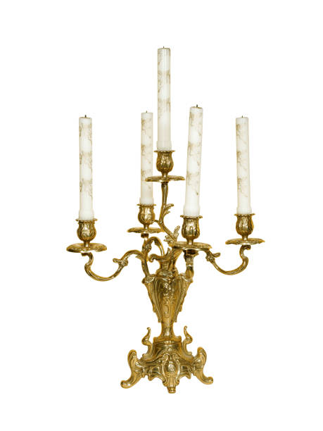 Retro golden candlestick holder with white candles