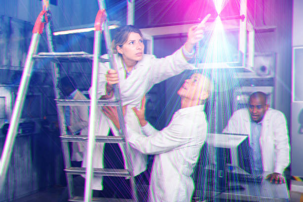 istock People in white coats are looking for key in a quest room stylized as an laboratory 1290666381