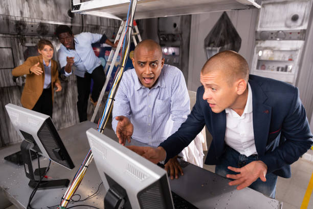 istock Men in anxiety looking for a solution on the computer in the quest room 1290666407