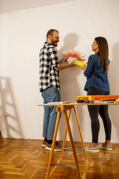 istock Looking at various color swathes and choosing a shade for wall paint 1290666505