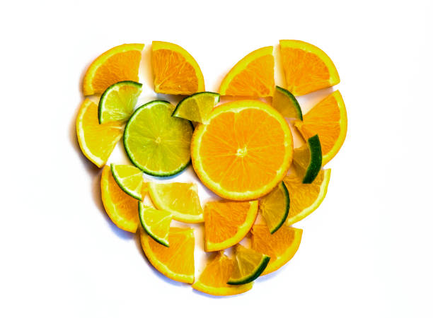 Heart of citrus fruit slices on a white background, top view