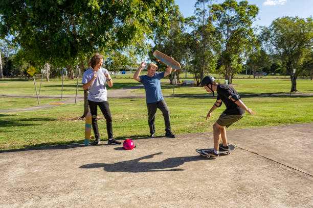 istock Skateboarder Being Cheered on By Friends 1290667445