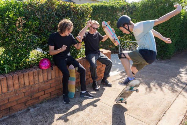 istock People Doing Skateboard Tricks on the Sidewalk 1290667453