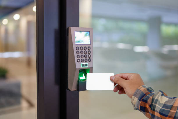 istock Yong man or woman use key card for access electronic door  control machine 1290670539