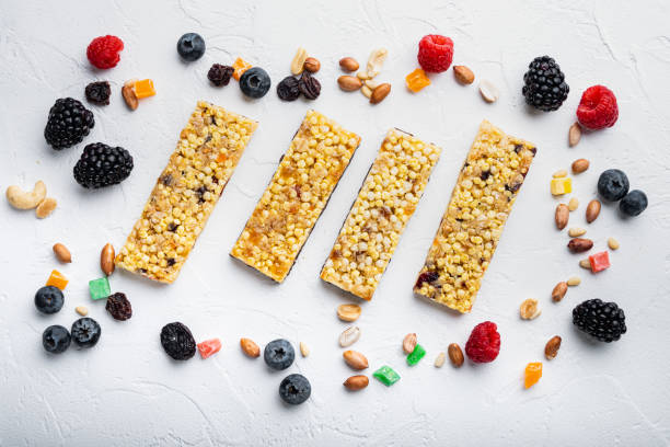 istock Granola bar and ingredients, flat lay, on white background 1290675178