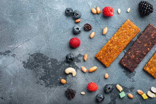 istock Dried fruits bars, top view with copy space, on grey background 1290677116