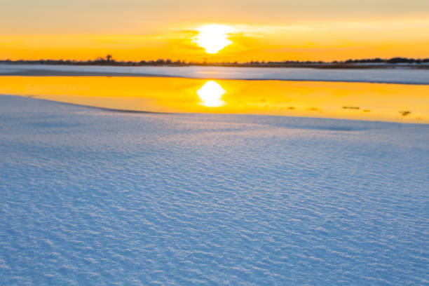istock quiet sunset over a winter plains and small pond 1290678760