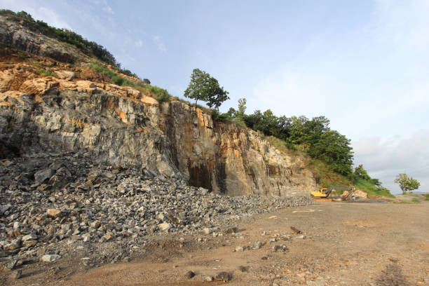 istock Earth movers in a granite quarry background 1290679603
