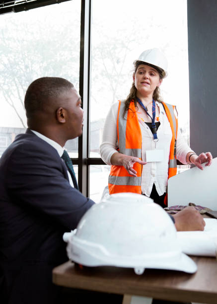 istock Civil engineers discussing in meeting at office 1290679969