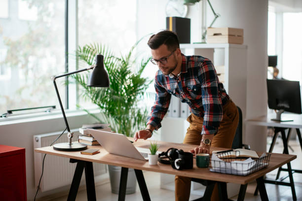 istock Young businessman working in the office 1290681448