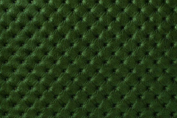 istock Texture of dark green leather background with capitone pattern, macro. 1290681486
