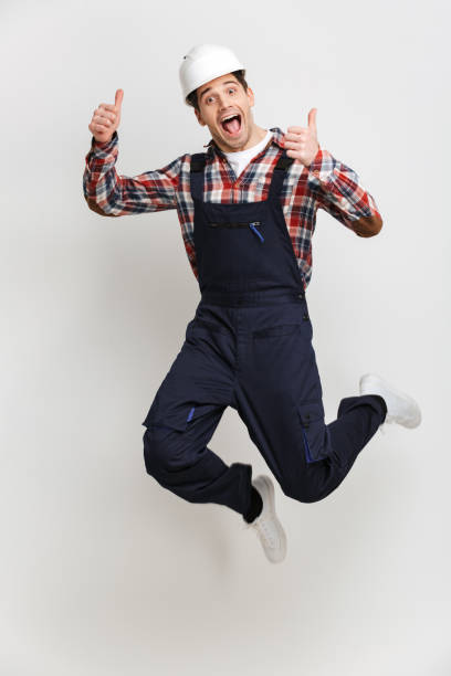 istock Full length image of Cheerful male builder in protective helmet 1290682577