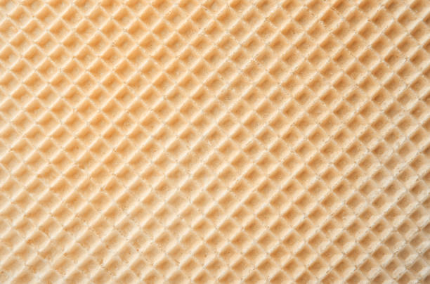 textura de oblea vacía como fondo. vista de primer plano de gofres dorados. vista superior con lugar para texto - wafer fotografías e imágenes de stock