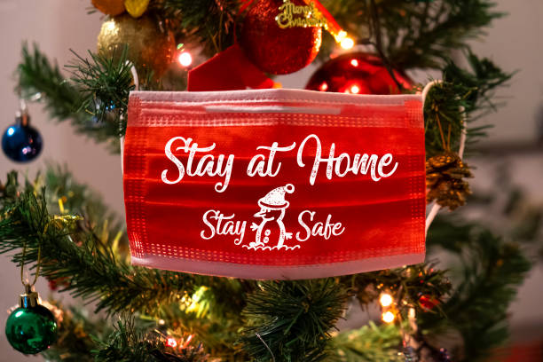 istock Christmas tree and red surgical Mask 1290682907