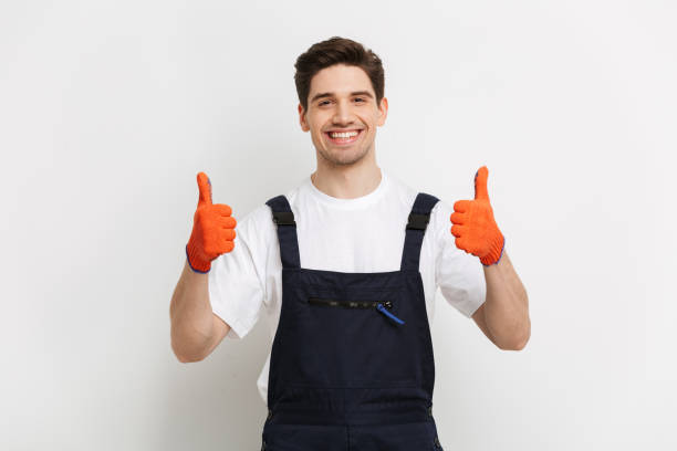 istock Smiling male builder in gloves showing thumbs up 1290683527
