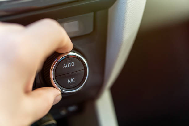 istock operating the ventilation and air conditioning system in the vehicle 1290683693