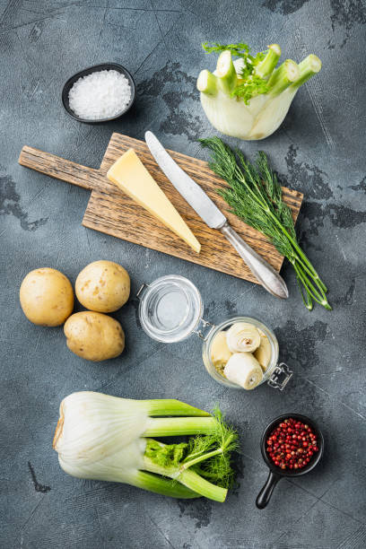 istock Fennel and artichoke with parmesan raw ingredients, on  grey background, flat lay 1290685783