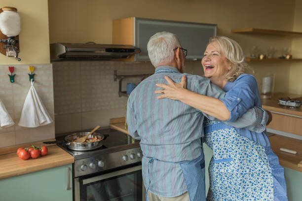 istock Elderly Couple Enjoying in Dance While Cooking at Home. 1290689852