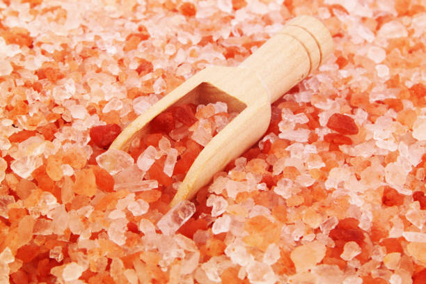 istock Himalayan pink salt and wooden scoop 1290690792