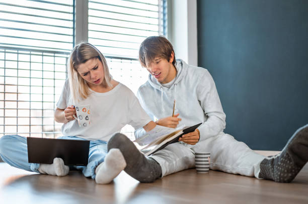 istock Young couple working from home 1290690970