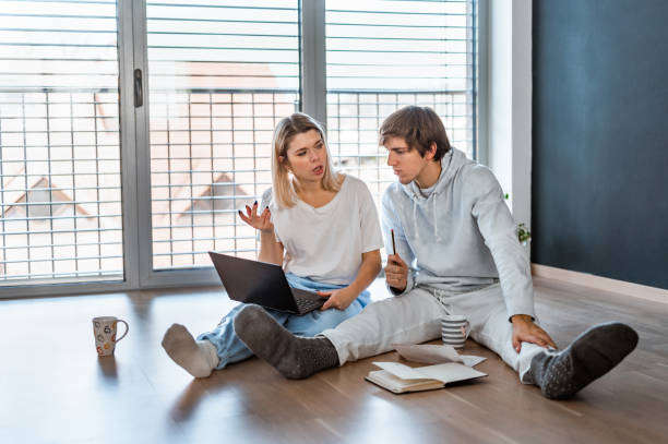 istock Young couple working from home 1290691020