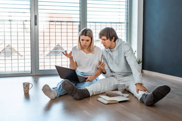 istock Young couple working from home 1290691061