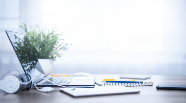 istock Office workplace with laptop, notebook and smart phone on desk. 1290691223