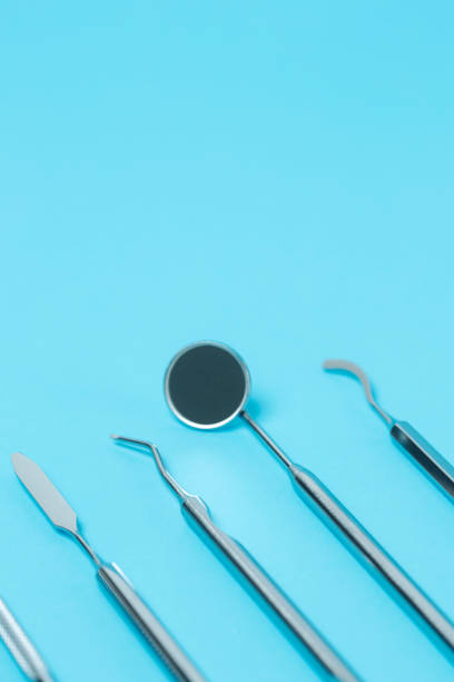 istock Dental  instruments on dentistry background. close-up 1290692260