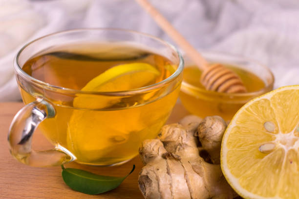 istock A cup of tea with ginger, honey and lemon.\nClose-up. 1290695837