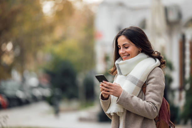 istock Female chatting with someone outside. 1290697063