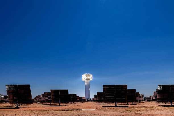 Landscape view of rays from solar energy generation plant in South African desert A low angle view of heliostats and generating tower at the Khi Solar One solar energy generation plant in the desert near Keimoes and Upington in the Northern Cape, South Africa. heliostat photos stock pictures, royalty-free photos & images