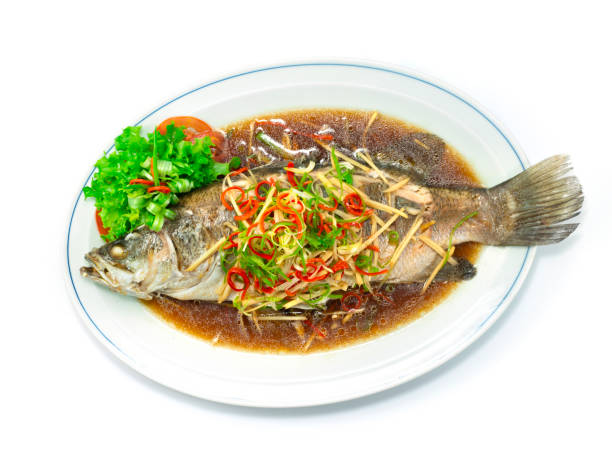 Steamed Sea bass Snapper Fish with Soy Sauce Chinese food stock photo