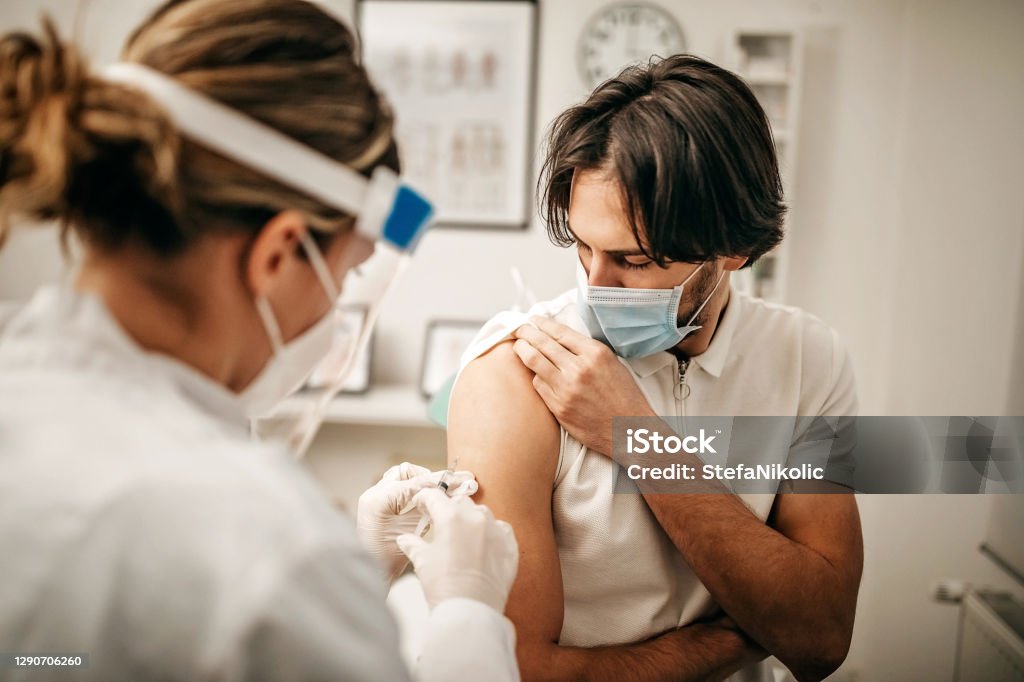 Coronavirus vaccination will be destroyed Medical doctor giving injection to make antibody for coronavirus Vaccination Stock Photo