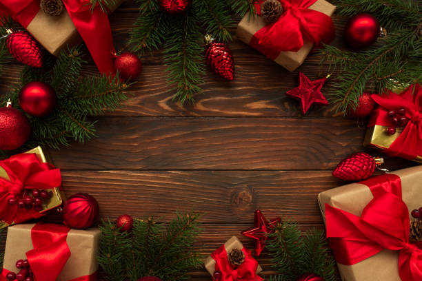 istock Christmas background with decorations and gift boxes on wooden table. Top view. Copy space.  Merry christmas and happy new year 1290707191