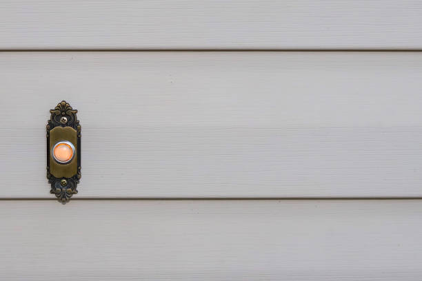 close-up image of a doorbell on a residential home stock photo