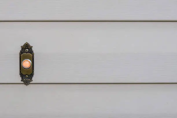 Photo of close-up image of a doorbell on a residential home